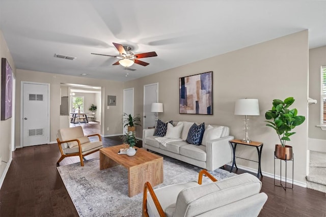 406 W 55th 1/2 St, Austin, TX 78751 - living area with a ceiling fan, baseboards, and wood finished floors