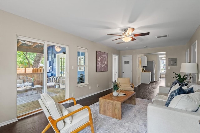 406 W 55th 1/2 St, Austin, TX 78751 - living area with wood finished floors, ceiling fan, baseboards, and electric panel