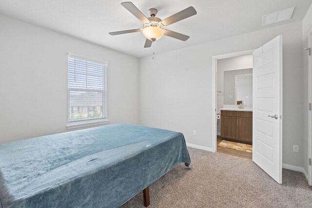 571 Sue Peaks Loop, Dripping Springs, TX 78620 - bedroom featuring a ceiling fan, light colored carpet, visible vents, a sink, and baseboards