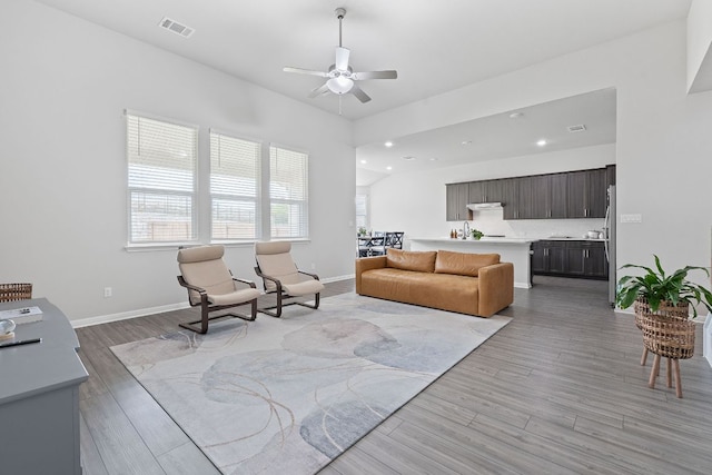 571 Sue Peaks Loop, Dripping Springs, TX 78620 - living room featuring visible vents, a ceiling fan, baseboards, and wood finished floors