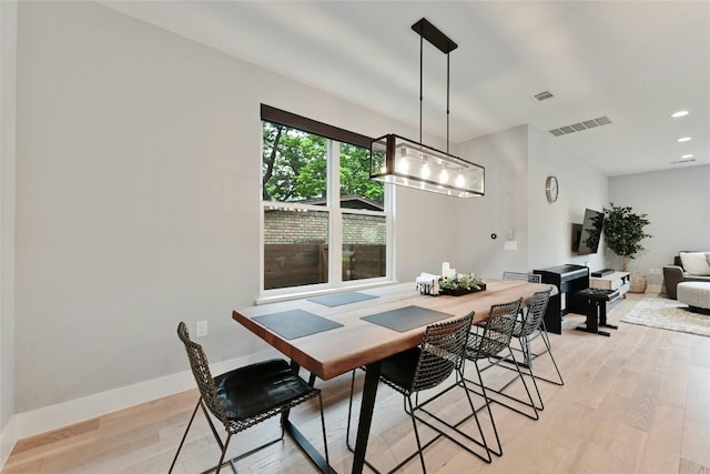7103 Daugherty St, Austin, TX 78757 - dining space with light wood-type flooring and recessed lighting