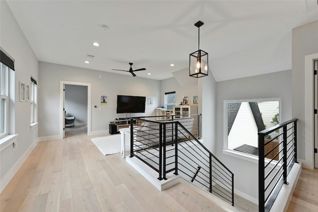 staircase with recessed lighting, baseboards, a ceiling fan, and wood finished floors