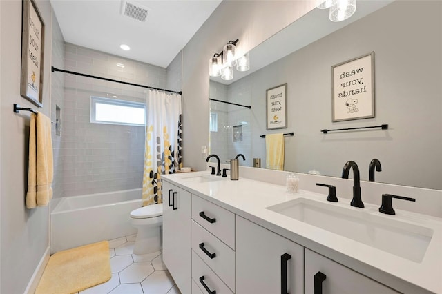 bathroom featuring a sink, tile patterned floors, toilet, and visible vents