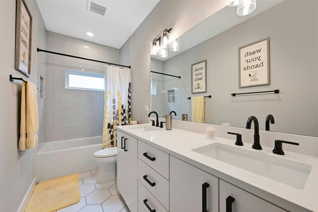7103 Daugherty St, Austin, TX 78757 - full bathroom with shower / bath combo, double vanity, and tile patterned floors