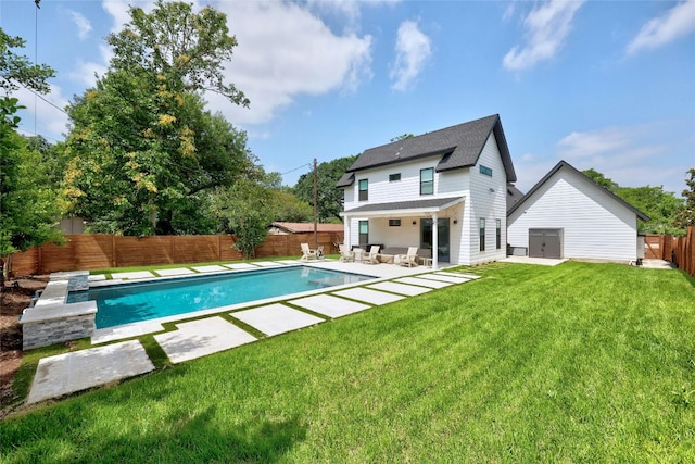 7103 Daugherty St, Austin, TX 78757 - back of property with a patio, a fenced backyard, and roof with shingles