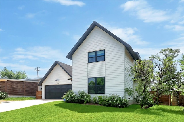 7103 Daugherty St, Austin, TX 78757 - view of front of home with an attached garage and concrete driveway