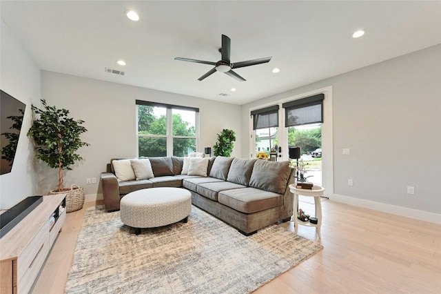 living area with ceiling fan, visible vents, baseboards, light wood-style floors, and recessed lighting