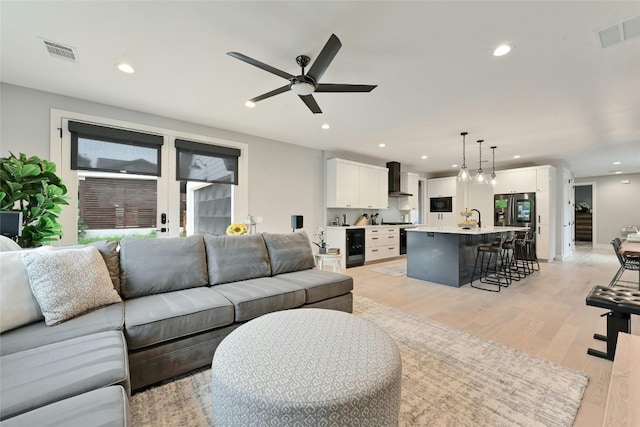 7103 Daugherty St, Austin, TX 78757 - living area featuring ceiling fan, recessed lighting, and light wood-style flooring