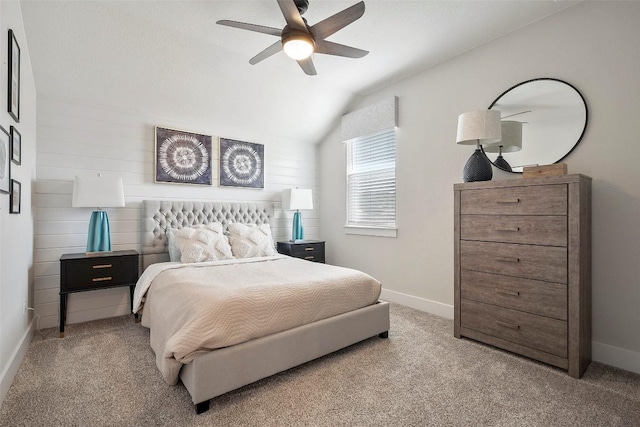 carpeted bedroom featuring baseboards, ceiling fan, and lofted ceiling