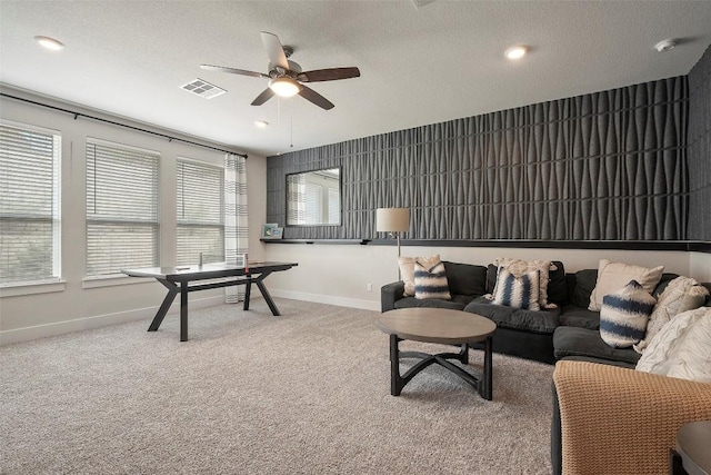 5812 Antelope Well Ln, Austin, TX 78738 - living area featuring ceiling fan, baseboards, a textured ceiling, and carpet