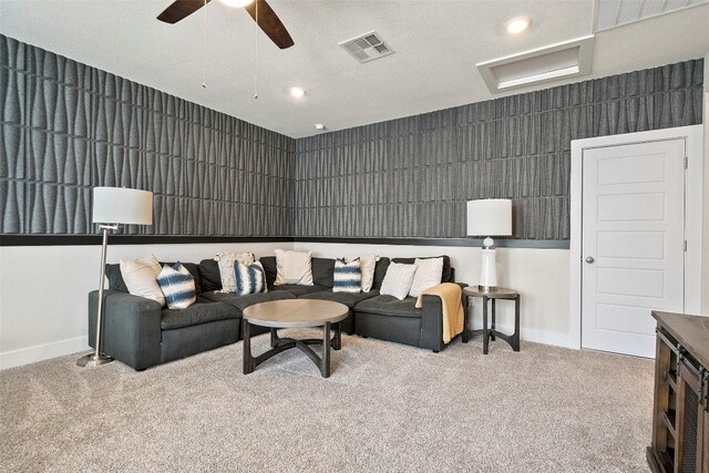 carpeted living room with a ceiling fan, baseboards, visible vents, and recessed lighting