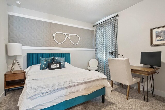 bedroom with baseboards and carpet flooring