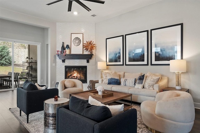 5812 Antelope Well Ln, Austin, TX 78738 - living room featuring wood finished floors, ceiling fan, and a fireplace