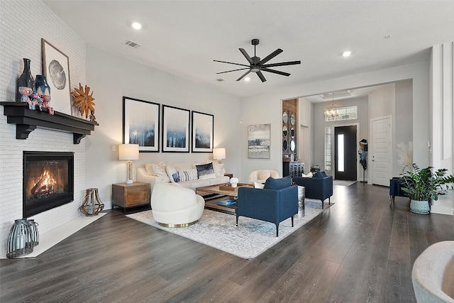 living area with visible vents, wood finished floors, a fireplace, ceiling fan, and recessed lighting