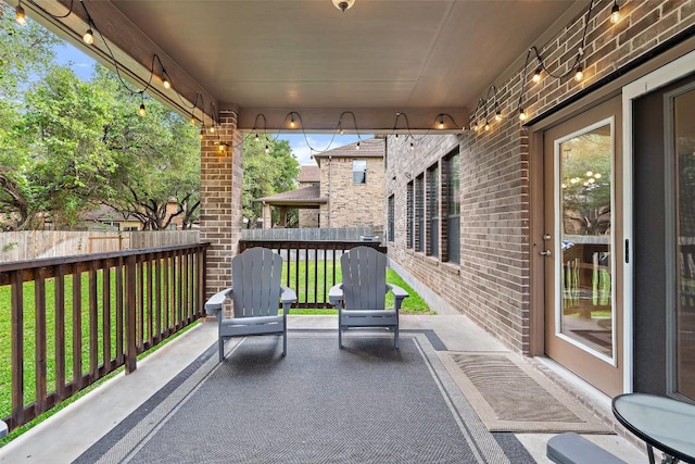 view of patio / terrace featuring fence