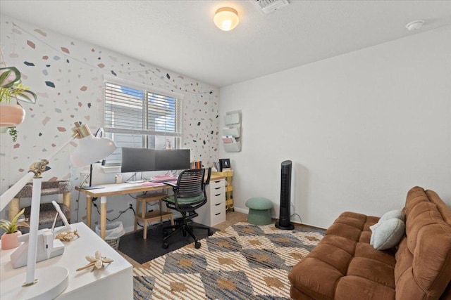 office space featuring baseboards, wallpapered walls, and visible vents