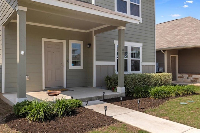 doorway to property featuring covered porch