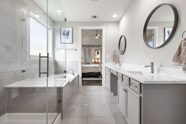 800 Kenney Fort Xing, Round Rock, TX 78665 - ensuite bathroom featuring a ceiling fan, plenty of natural light, a shower stall, and recessed lighting