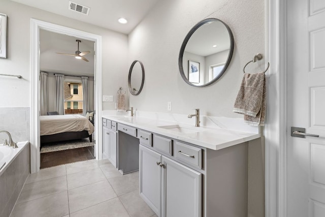 800 Kenney Fort Xing, Round Rock, TX 78665 - bathroom featuring tile patterned flooring, ceiling fan, double vanity, ensuite bath, and plenty of natural light