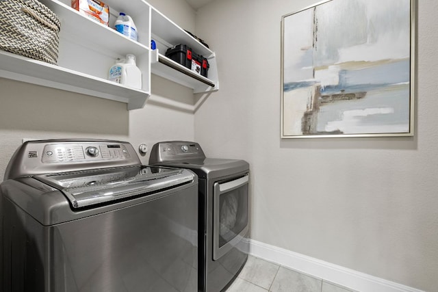 800 Kenney Fort Xing, Round Rock, TX 78665 - laundry room with washing machine and clothes dryer, baseboards, and light tile patterned flooring