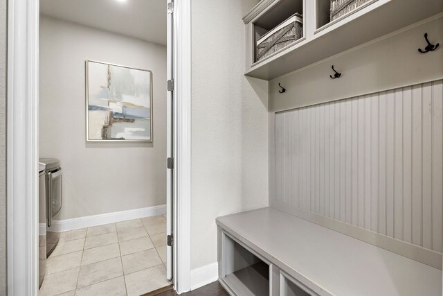 800 Kenney Fort Xing, Round Rock, TX 78665 - mudroom with independent washer and dryer, baseboards, and light tile patterned floors