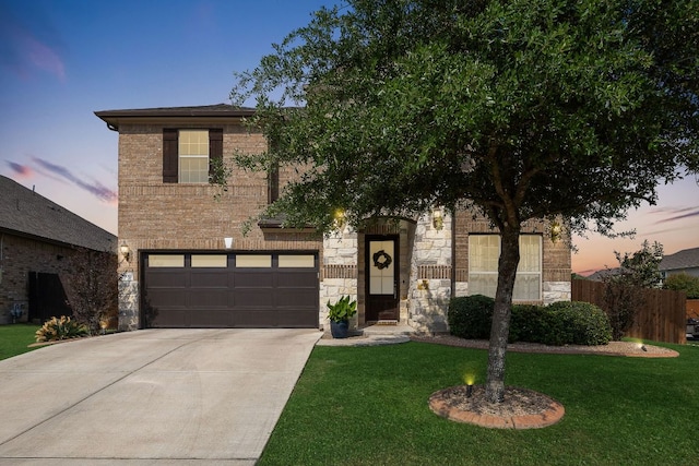 800 Kenney Fort Xing, Round Rock, TX 78665 - view of front facade with concrete driveway, a garage, and stone siding