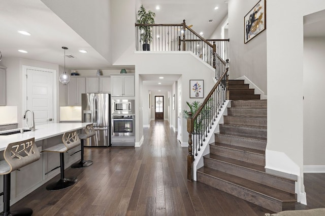 800 Kenney Fort Xing, Round Rock, TX 78665 - entrance foyer with dark wood finished floors, stairs, baseboards, and recessed lighting