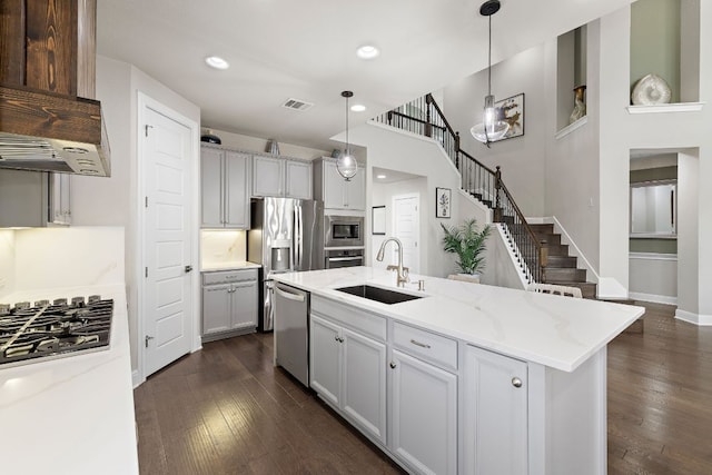 800 Kenney Fort Xing, Round Rock, TX 78665 - kitchen featuring a sink, appliances with stainless steel finishes, dark wood-type flooring, recessed lighting, and light stone countertops