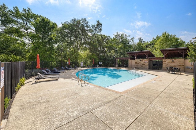 800 Kenney Fort Xing, Round Rock, TX 78665 - community pool with a patio, fence, a gazebo, and view of wooded area