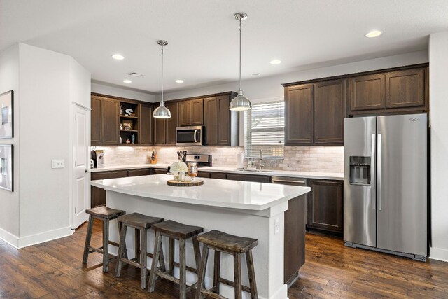 1403 Matthews Ln, Austin, TX 78745 - kitchen with appliances with stainless steel finishes, open shelves, dark brown cabinets, light countertops, and recessed lighting