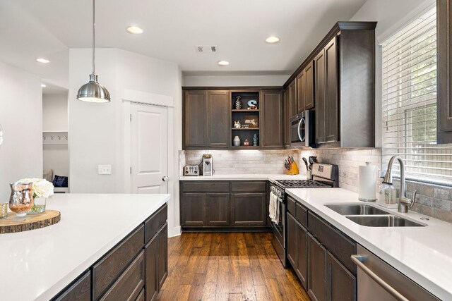1403 Matthews Ln, Austin, TX 78745 - kitchen featuring stainless steel appliances, dark brown cabinetry, light countertops, decorative backsplash, and recessed lighting