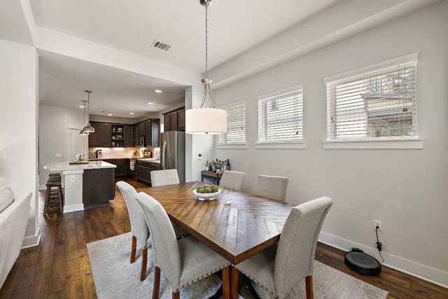 1403 Matthews Ln, Austin, TX 78745 - dining area featuring dark wood-style flooring and recessed lighting