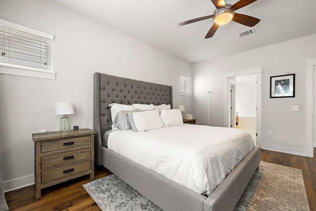 1403 Matthews Ln, Austin, TX 78745 - bedroom featuring dark wood finished floors, ensuite bathroom, and a ceiling fan