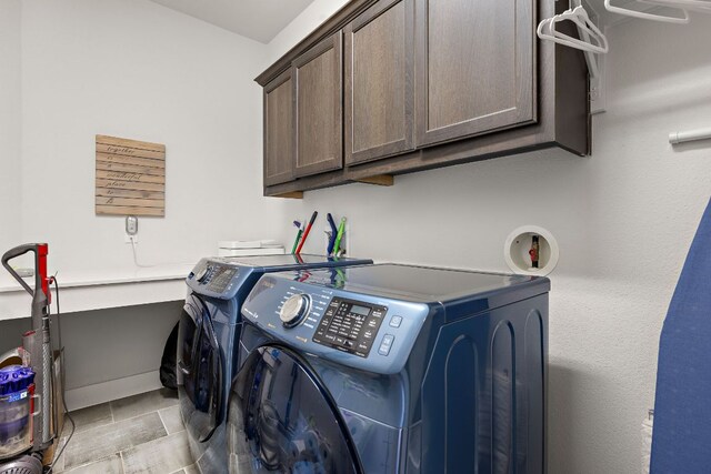 1403 Matthews Ln, Austin, TX 78745 - laundry area with independent washer and dryer and cabinet space
