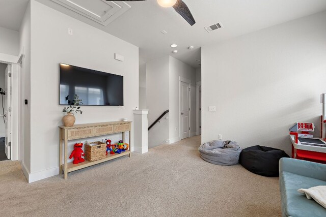 1403 Matthews Ln, Austin, TX 78745 - carpeted living area featuring attic access and baseboards