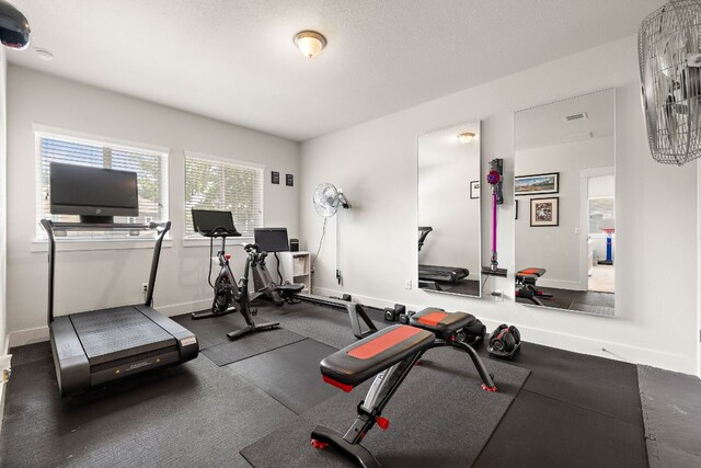 1403 Matthews Ln, Austin, TX 78745 - workout room with baseboards