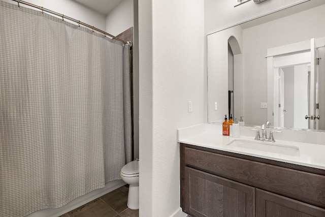 full bathroom featuring vanity, shower / bath combo, and toilet