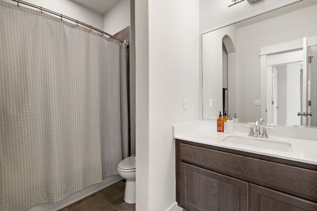 1403 Matthews Ln, Austin, TX 78745 - full bathroom featuring vanity and toilet