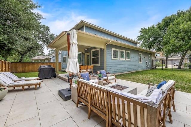 back of house featuring a fenced backyard, an outdoor living space with a fire pit, a yard, and a patio area