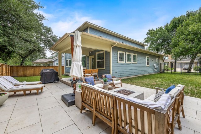 1403 Matthews Ln, Austin, TX 78745 - fenced backyard with area for grilling, an outdoor living space with a fire pit, and a patio