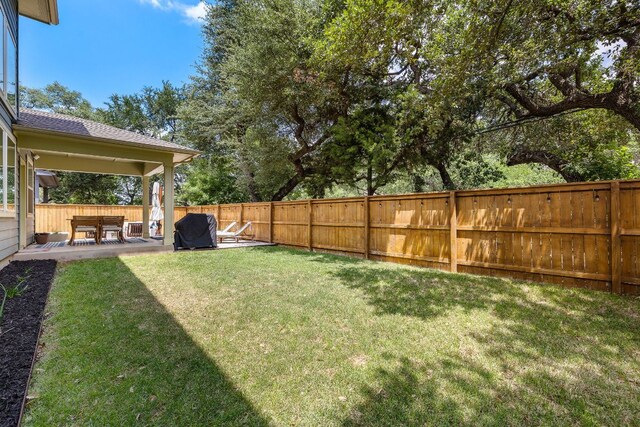 1403 Matthews Ln, Austin, TX 78745 - fenced backyard with a patio area