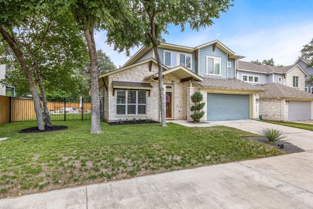 1403 Matthews Ln, Austin, TX 78745 - view of front of property featuring stone siding, driveway, and an attached garage