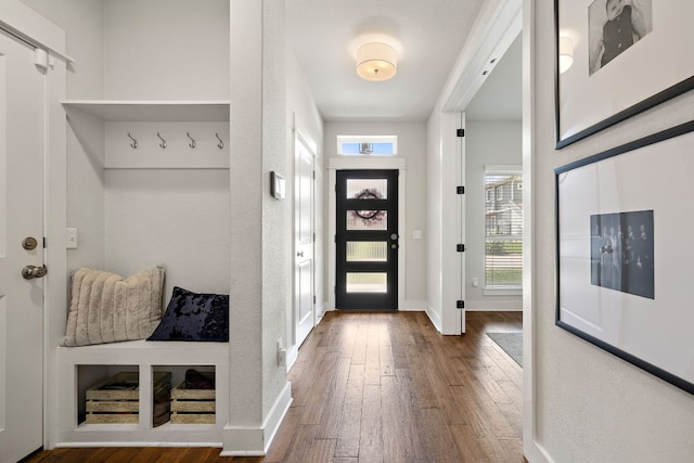 mudroom featuring baseboards and hardwood / wood-style floors