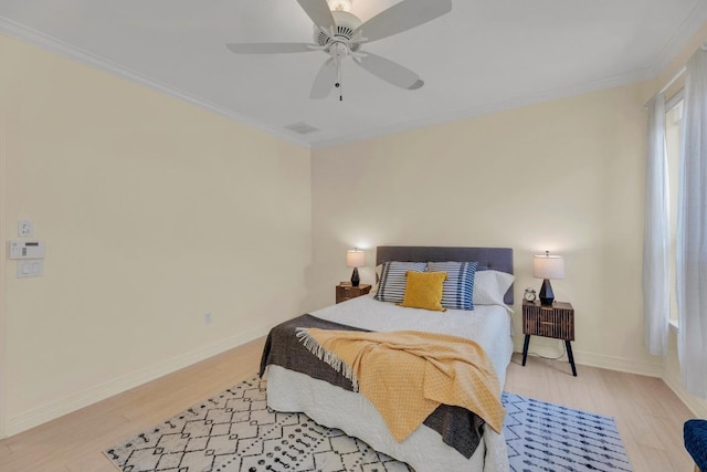 4128 E Lawless St, Austin, TX 78723 - bedroom featuring crown molding, light wood-style floors, and ceiling fan