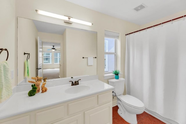 full bathroom with toilet, visible vents, plenty of natural light, and vanity