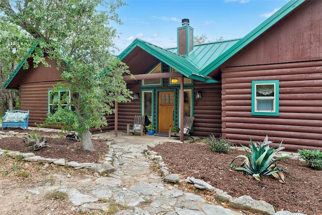 9854 N Weir Loop Cir, Austin, TX 78736 - view of front of house featuring a chimney and metal roof