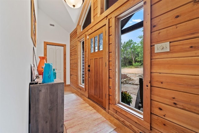 9854 N Weir Loop Cir, Austin, TX 78736 - entryway featuring vaulted ceiling, light wood-style flooring, and visible vents