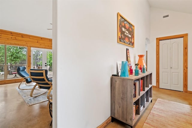 9854 N Weir Loop Cir, Austin, TX 78736 - hallway featuring visible vents, concrete flooring, high vaulted ceiling, french doors, and arched walkways