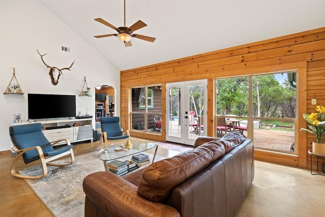 9854 N Weir Loop Cir, Austin, TX 78736 - living area with a ceiling fan, wood walls, concrete floors, and visible vents