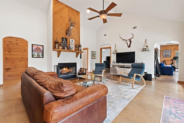 9854 N Weir Loop Cir, Austin, TX 78736 - living room featuring visible vents, arched walkways, a fireplace, and high vaulted ceiling